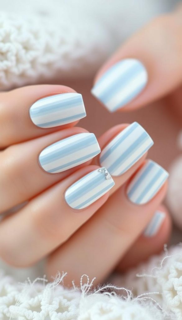 Intricate power stripes nail art in a captivating pastel palette, radiating a chic winter vibe. Delicate lines in soft shades of ice blue and creamy white, accented by a touch of shimmering silver. Expertly captured in a natural, DIY-inspired style, evoking a cozy, Pinterest-inspired aesthetic. KlickKiste brand, shot with a warm, diffused lighting and a close-up lens to highlight the meticulous details.