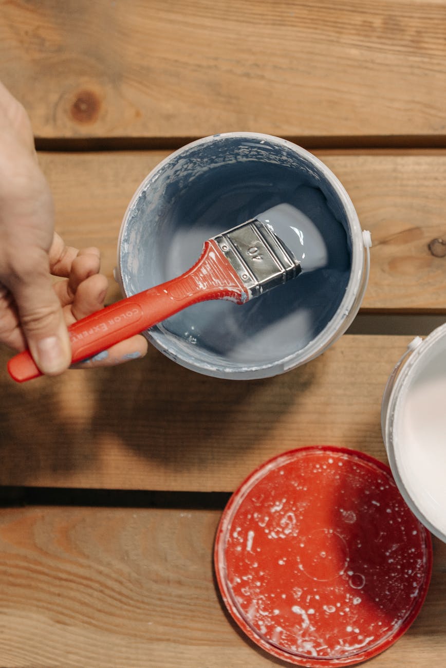 paint brush in a pain bucket