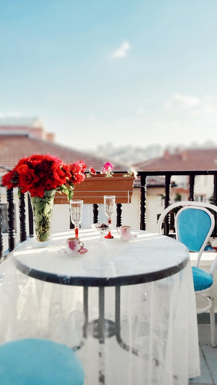 balcony chair wine glasses table setting
